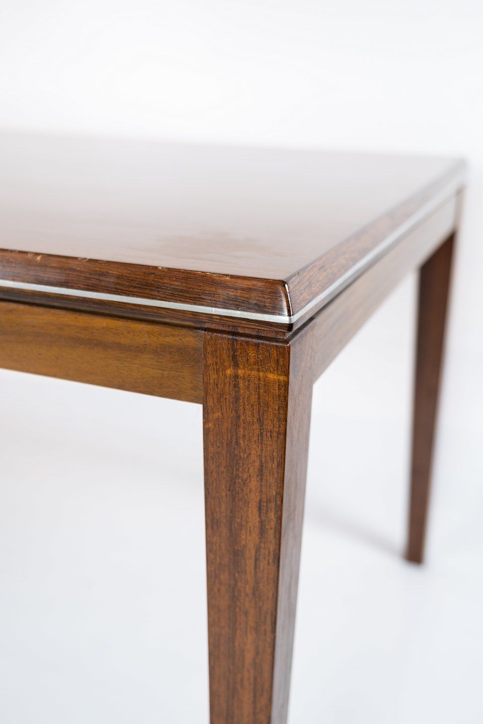 Coffee Table Made In Rosewood Decorated With Metal Edge Of Danish Design From The 1960s. photo Furniture