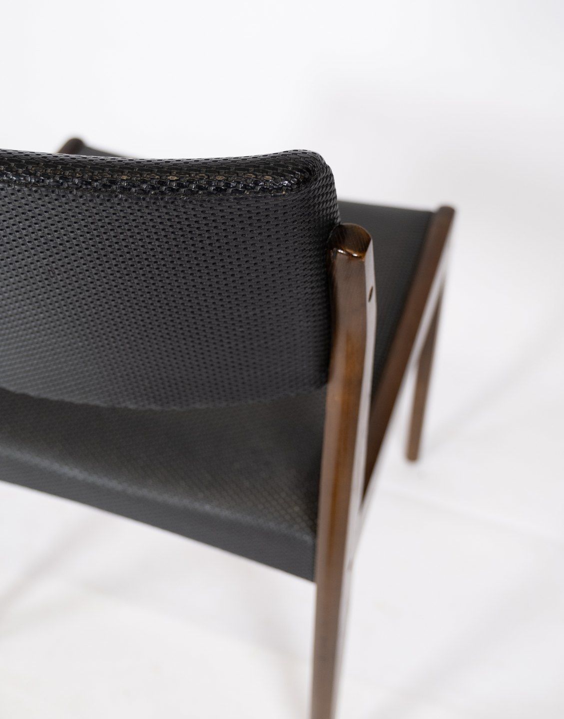 Set Of Four Dining Chairs Of Black Upholstery And Dark Wood Of Danish Design From The 1960s. photo vintage