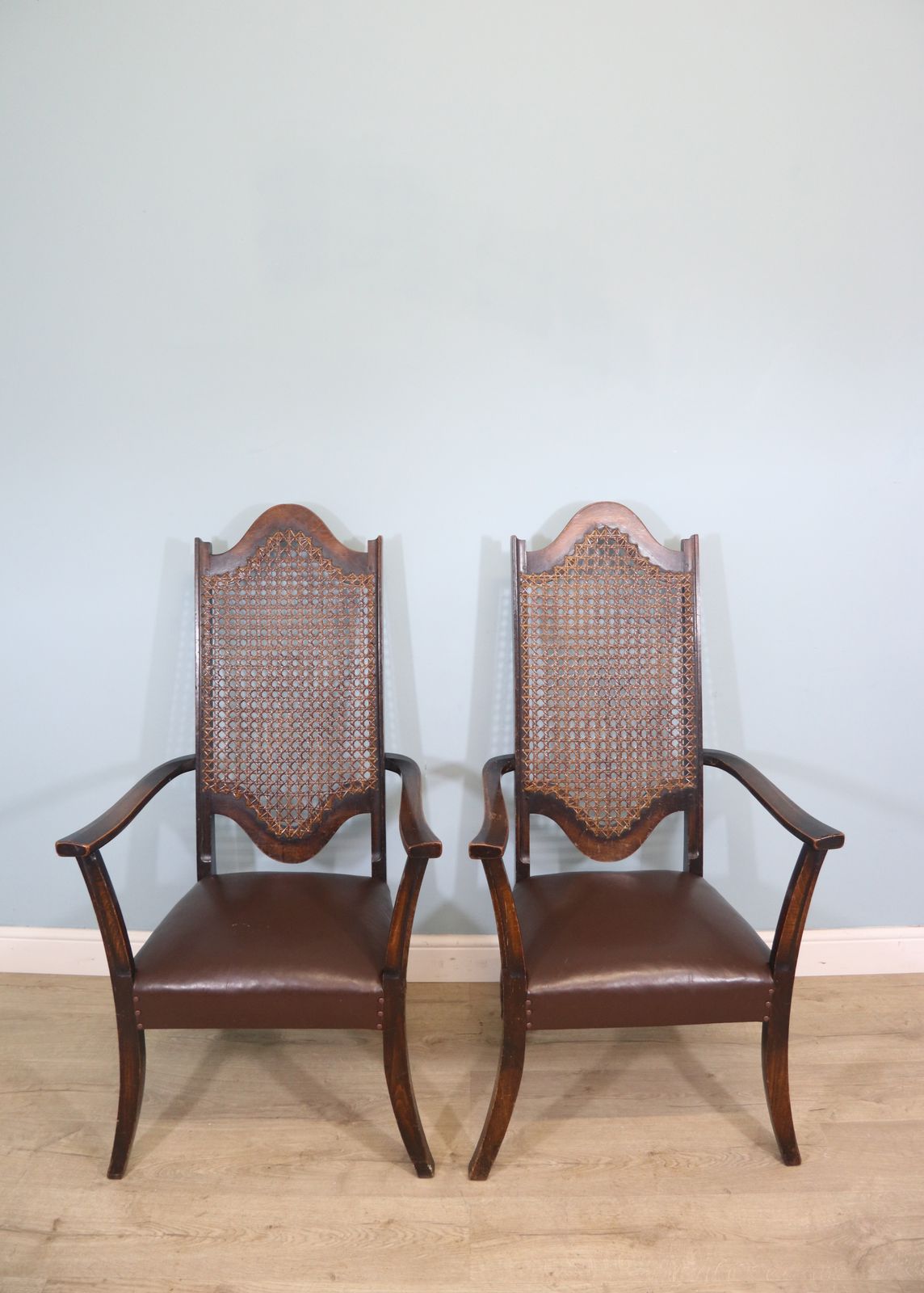 A Lovely Pair Of Early 20th Century Industrial Looking Cane Shield Back Armchairs photo for sale