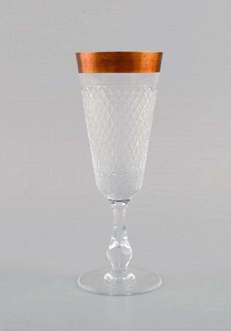 Four Champagne Glasses In Mouth Blown Crystal Glass With Gold Edge, France 1930s photo furniture