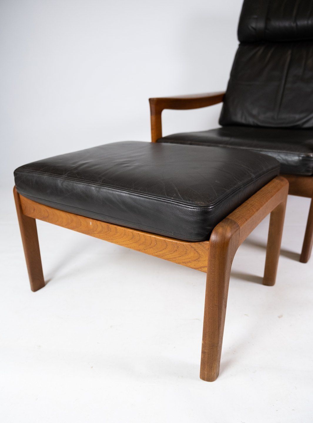 Armchair And Stool In Teak Upholstered With Black Leather Designed By Arne Vodder And Manufactured By Komfort In The 1960s. photo for sale