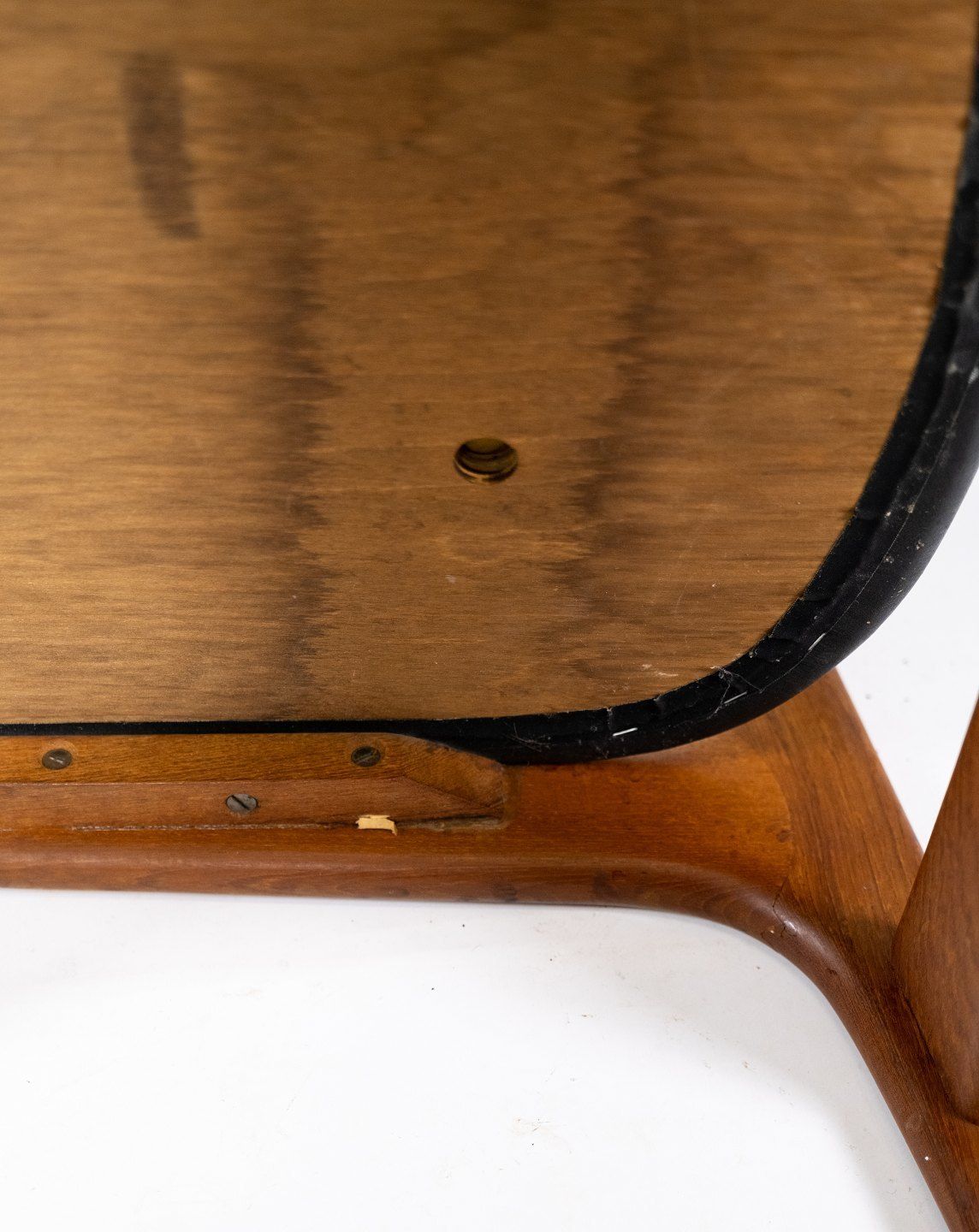 A Set Of Four Dining Chairs In Teak And Upholstered With Black Leather Of Danish Design From The 1960s. photo vintage
