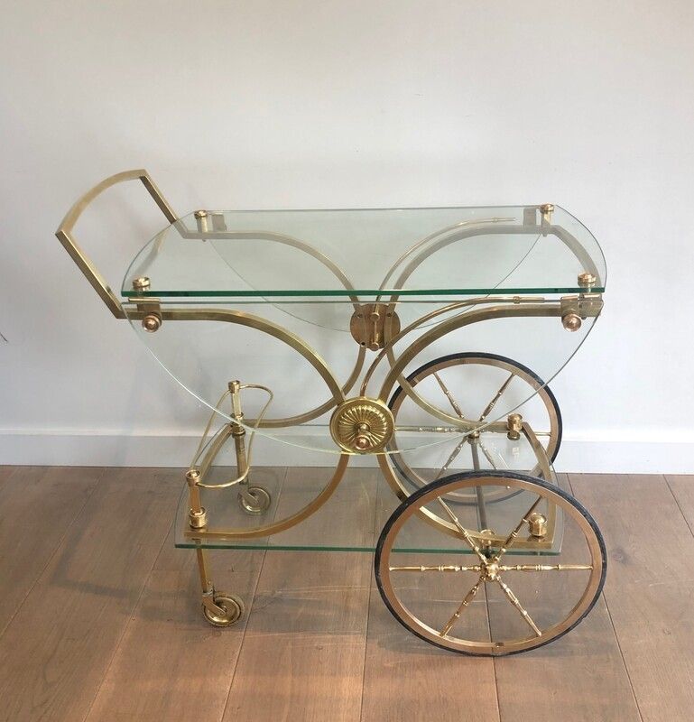 Maison Bagués. Rare Neoclassical Style Brass And Glass Drinks Trolley With Folding Rounded Glass Sides. French. Circa 1940 photo furniture