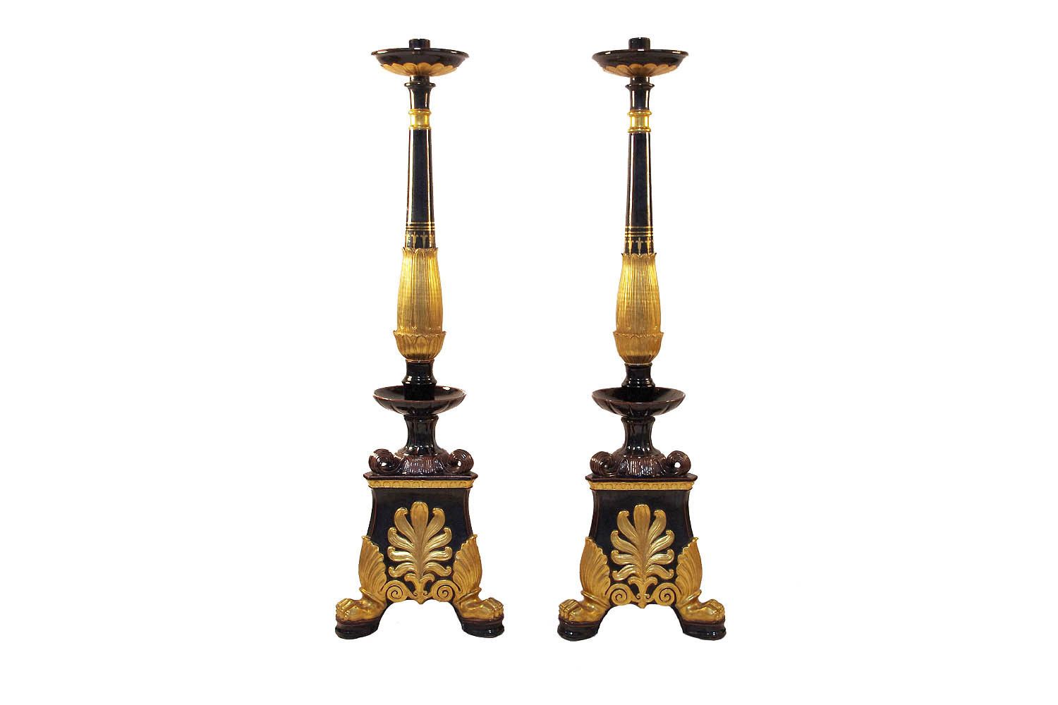 Pair Of Restoration Style Torches In Black And Gilded Earthenware Circa 1950