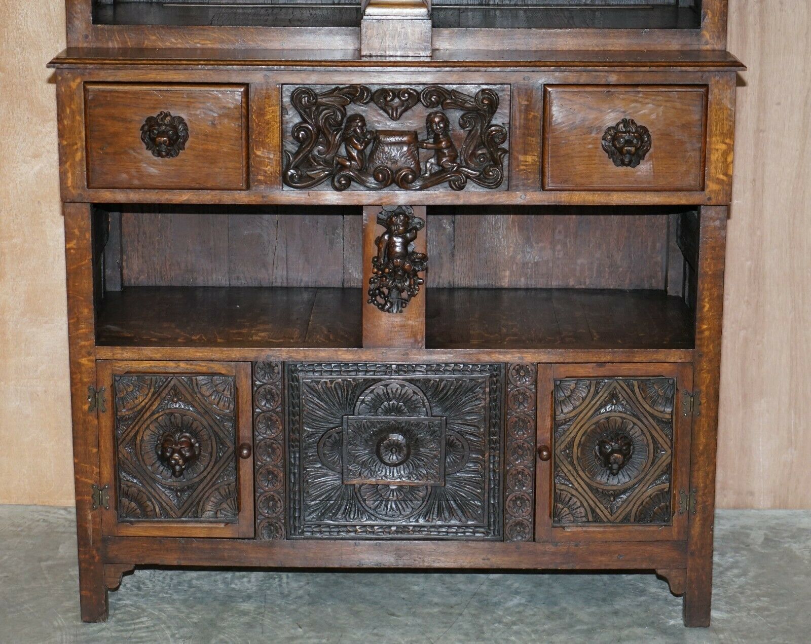 Large Heavily Carved Bookcase Cupboard With Ornate Cherub Putti & Lion Figures photo for sale