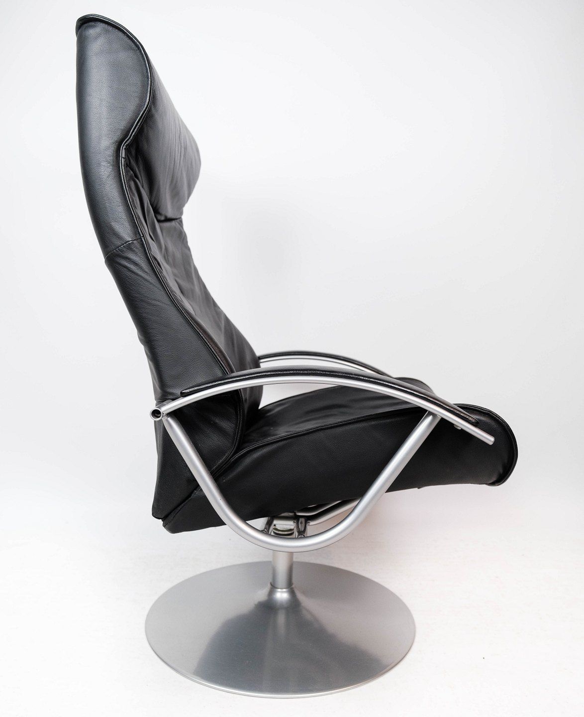 Armchair With Stool Upholstered In Black Leather And Metal Frame, By Danish Design From The 1970s. photo for sale