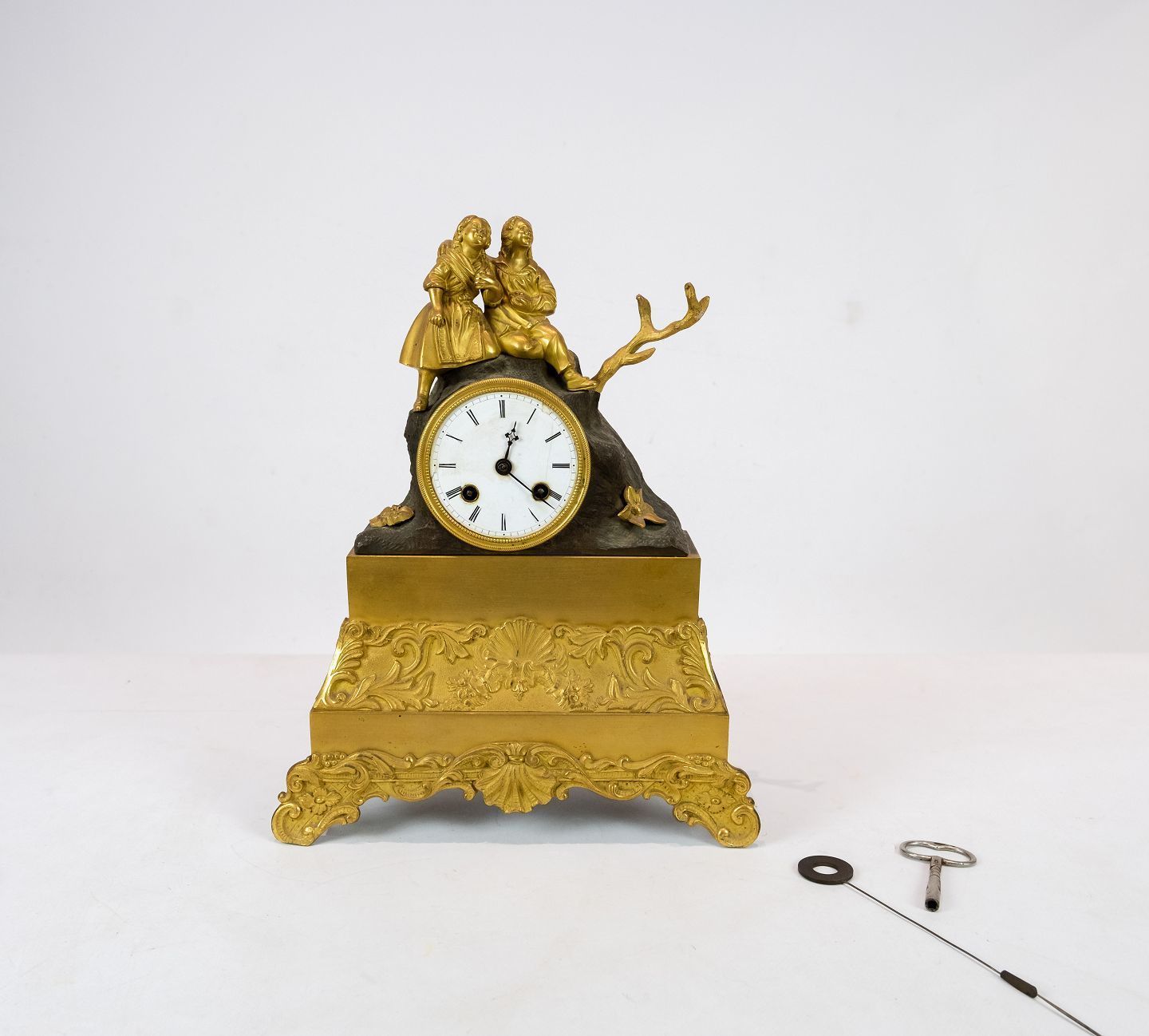 French Clock Of Gilded Bronze From The 1820s.