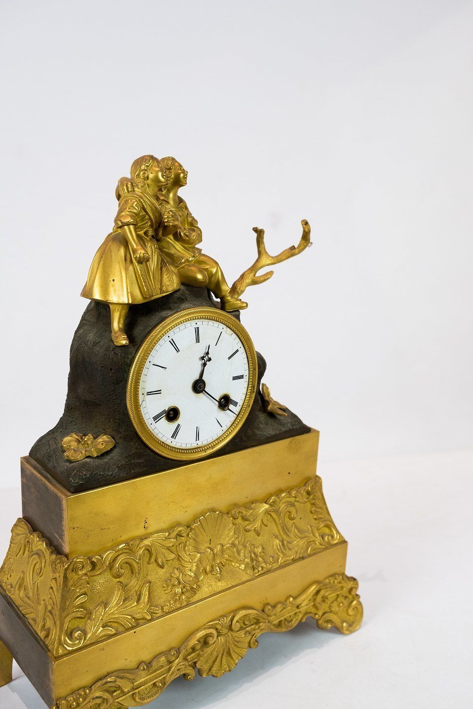 French Clock Of Gilded Bronze From The 1820s. photo Home Decor