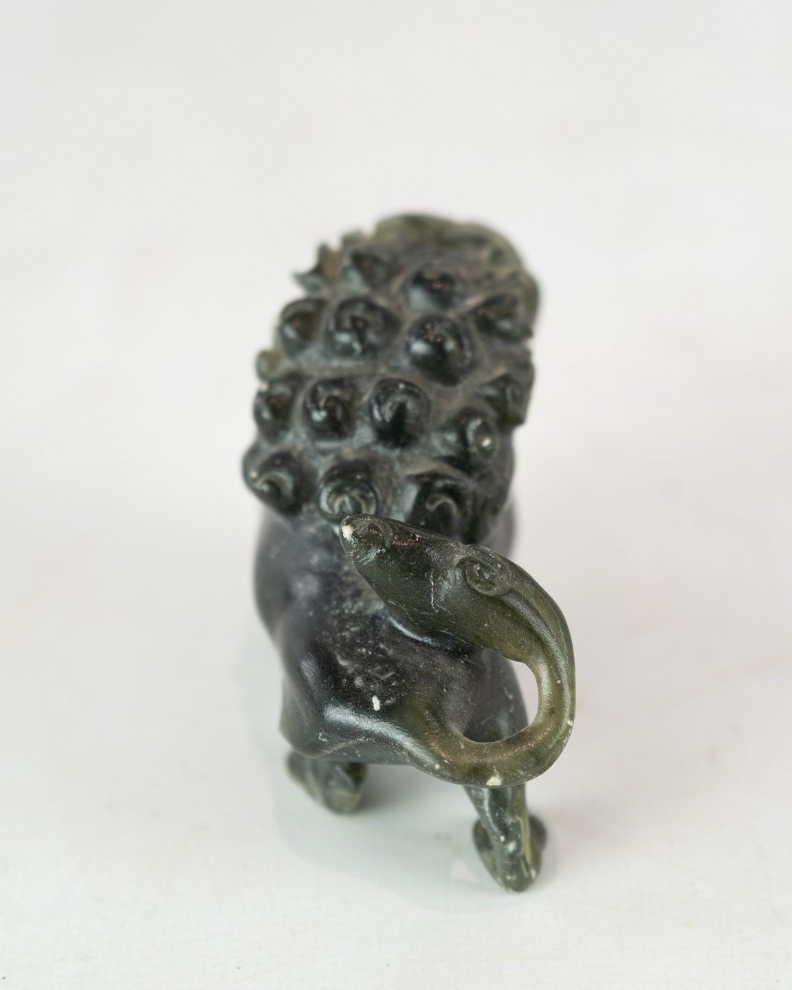 A Pair Of Soapstone Figures In The Shape Of Lions photo Art