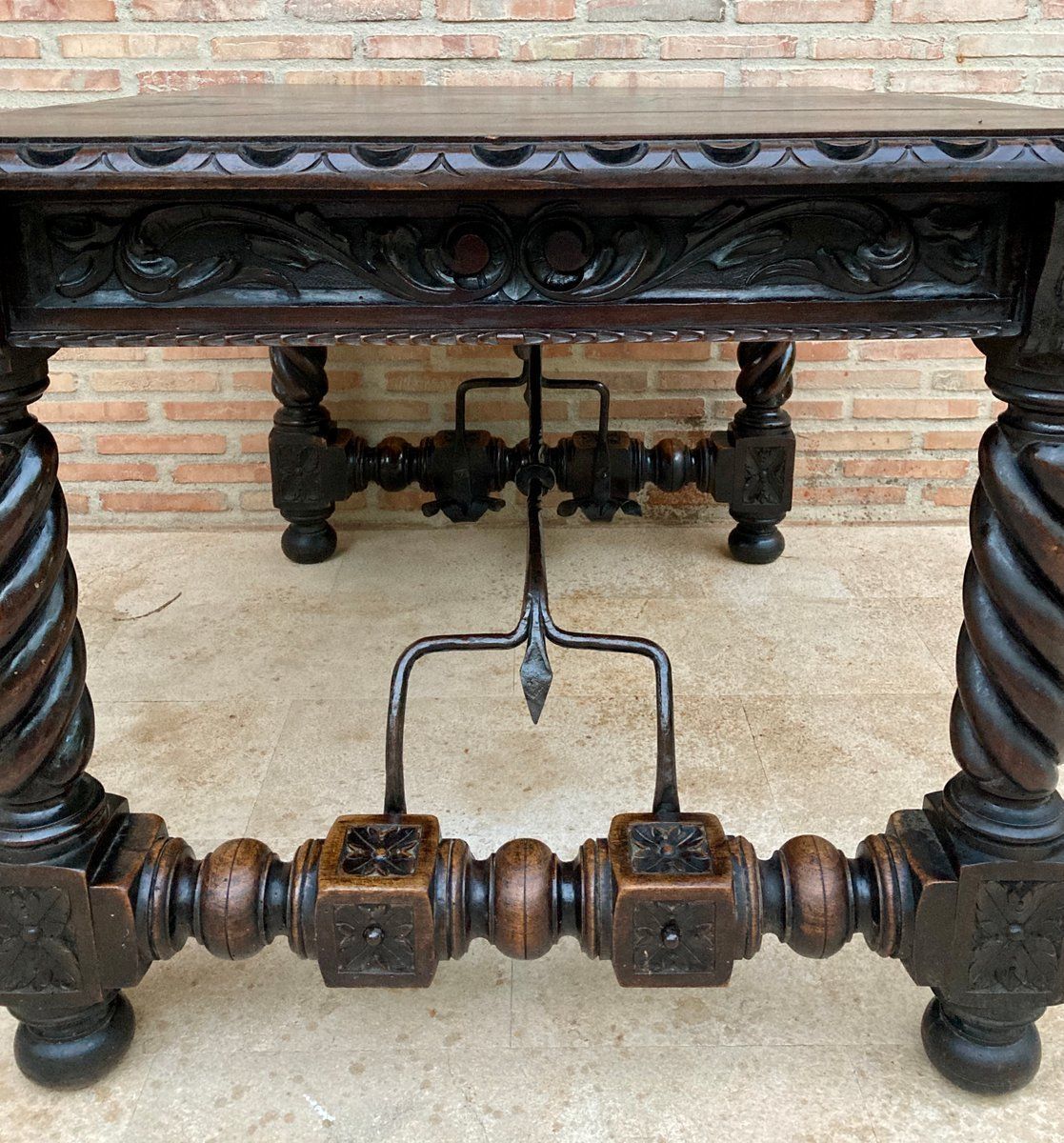 photo vintage Spanish Baroque Table With Dark Walnut Solomonic Legs With Carved Structure And Iron Stretcher