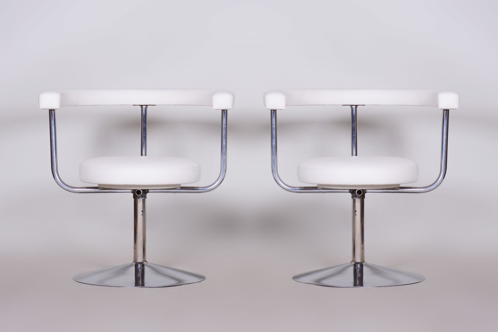 photo for sale Pair Of White Leather Swivel Chairs Made In Czechia, 1940s. Fully Restored.