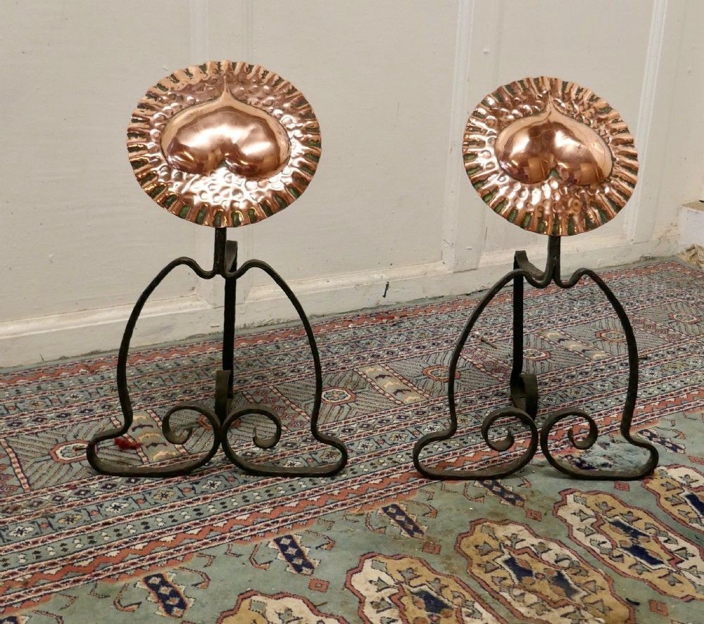 A Pair Of Arts And Crafts Copper And Iron Andirons Or Fire Dogs