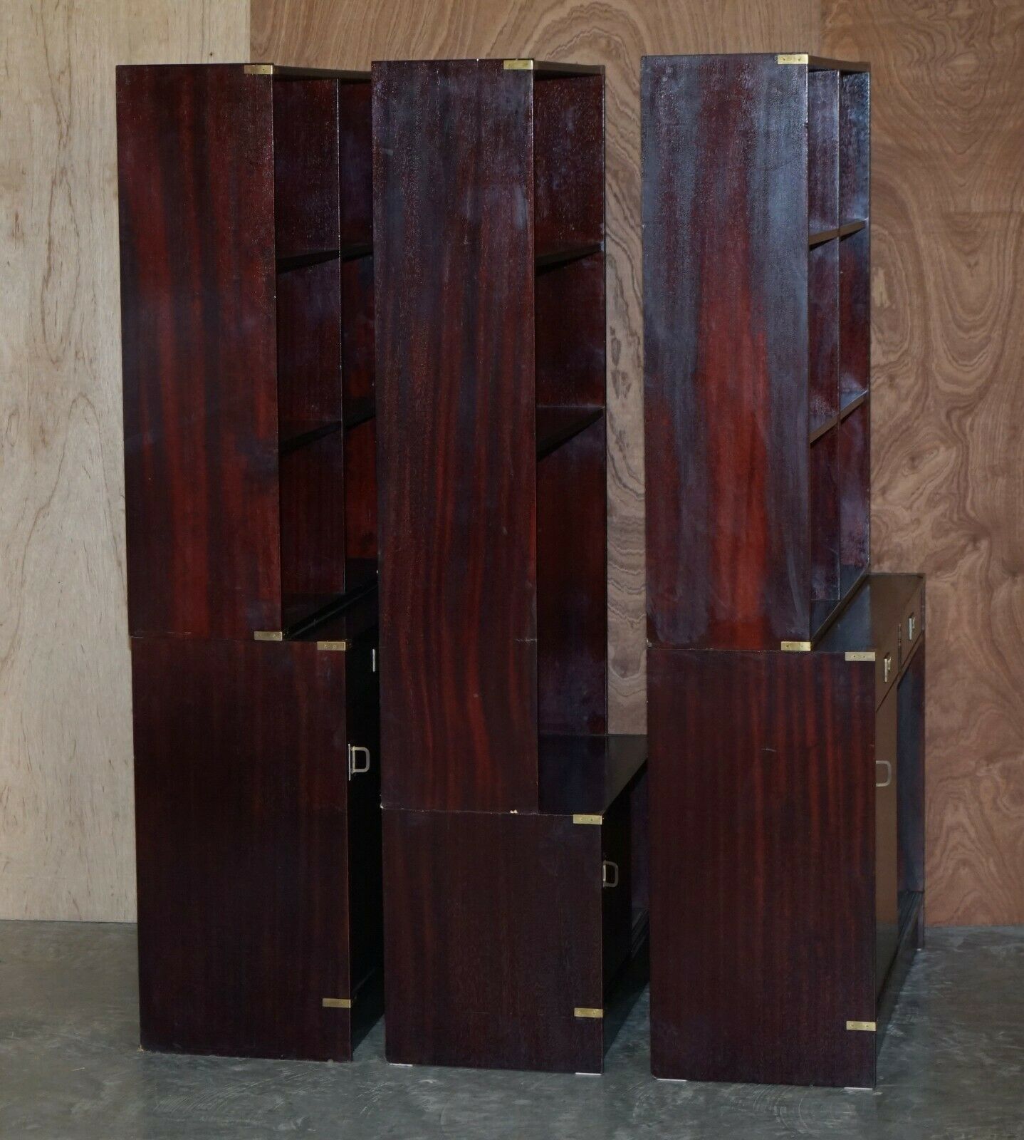 1850.0 Three Vintage Mahogany Finish Military Campaign Bookcases Used For Media Storage photo