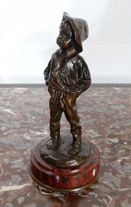 Bronze “Boy With His Hands In His Pockets”   1910 photo furniture