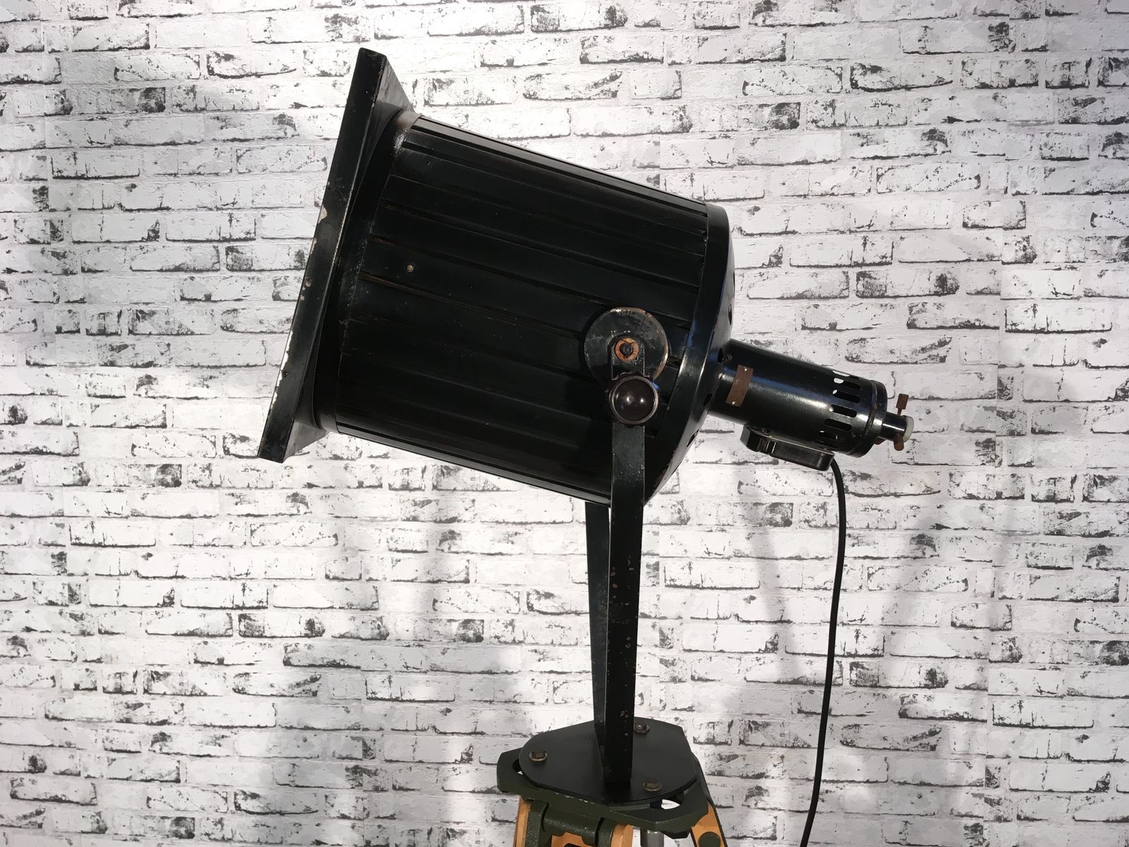 Black Vintage Industrial Spotlight On Wooden Tripod  photo buy