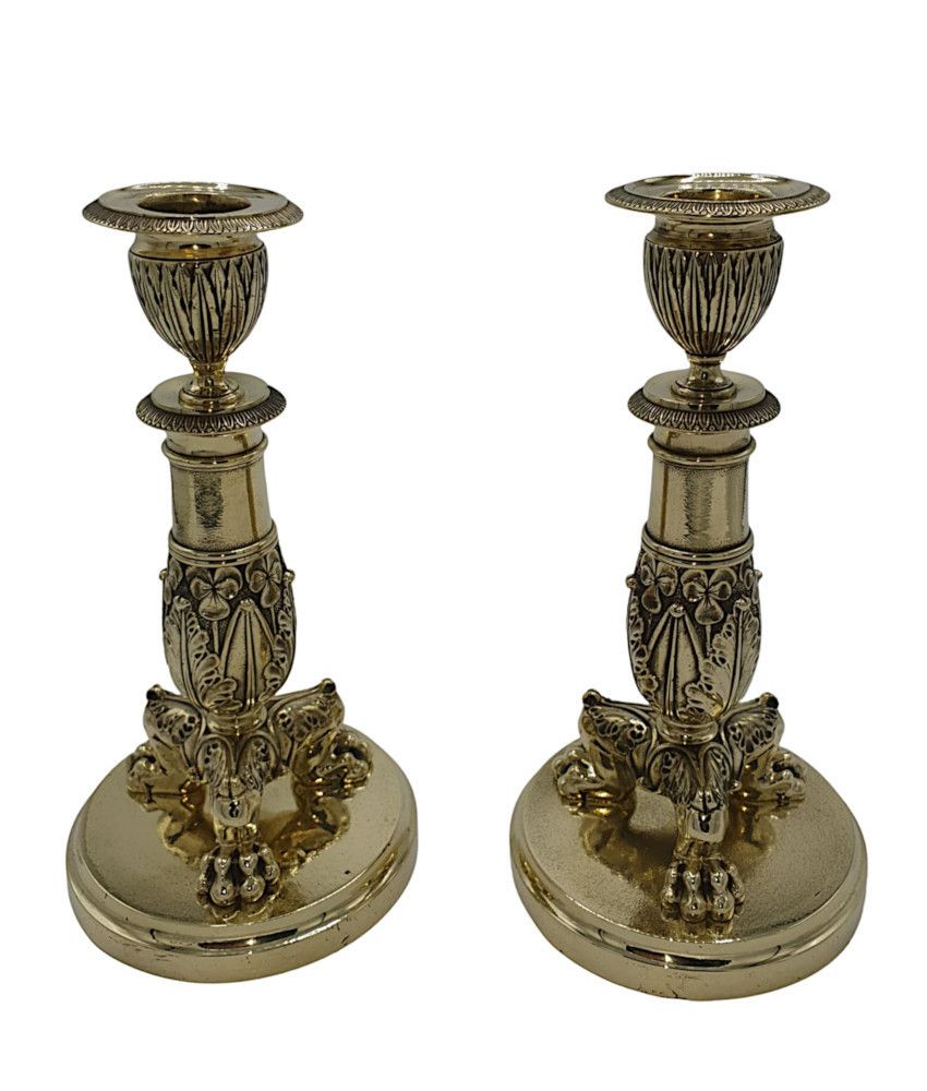 A Beautiful Pair Of 19th Century Empire Style Polished Brass Candlesticks