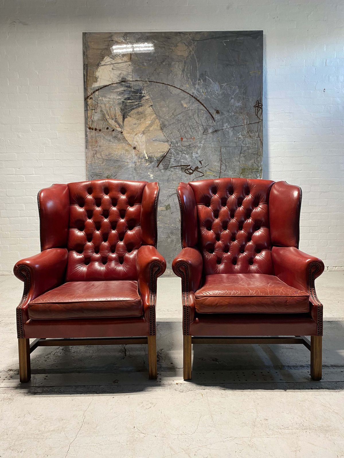 A Very Good Matching Pair Of Midc Gentleman’s Wing Chairs In Raspberry Leather photo furniture