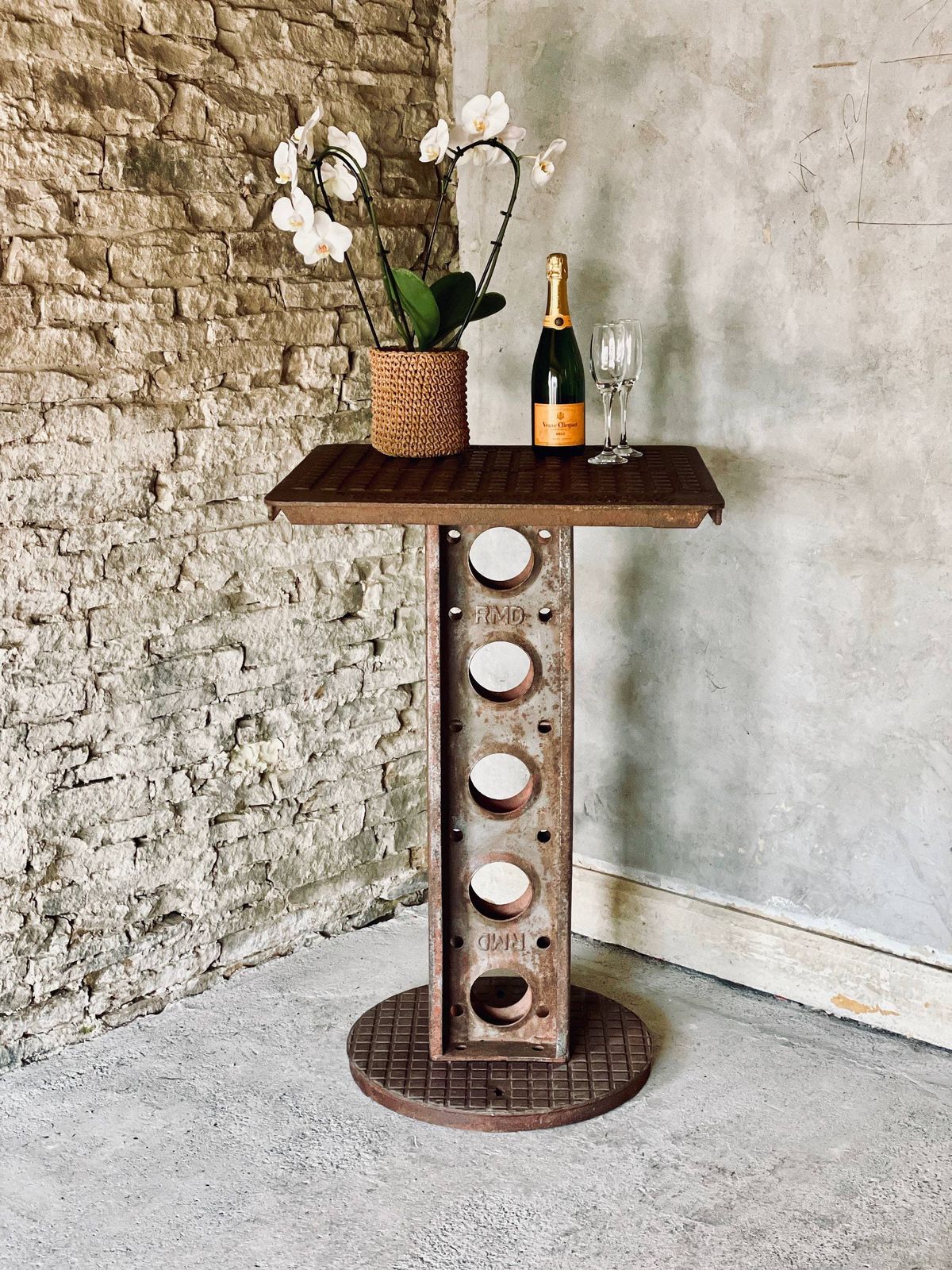 photo furniture Dino Reclaimed Manhole Bar Table With A Heavy Steel Pedestal Base