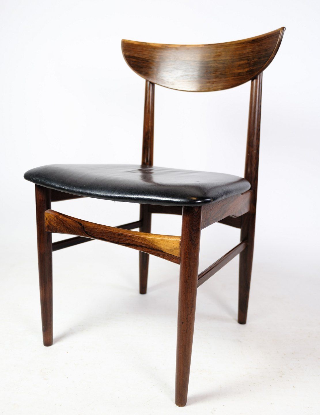 A Set Of Six Dining Table Chairs Of Danish Design In Rosewood With Black Leather From The 1960s. photo for sale