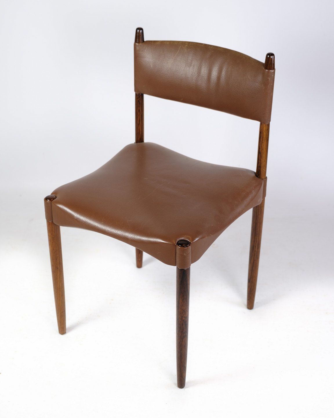 A Set Of 6 Chairs Of Danish Design Made In Solid Rosewood With Brown Leather From 1960s. photo furniture