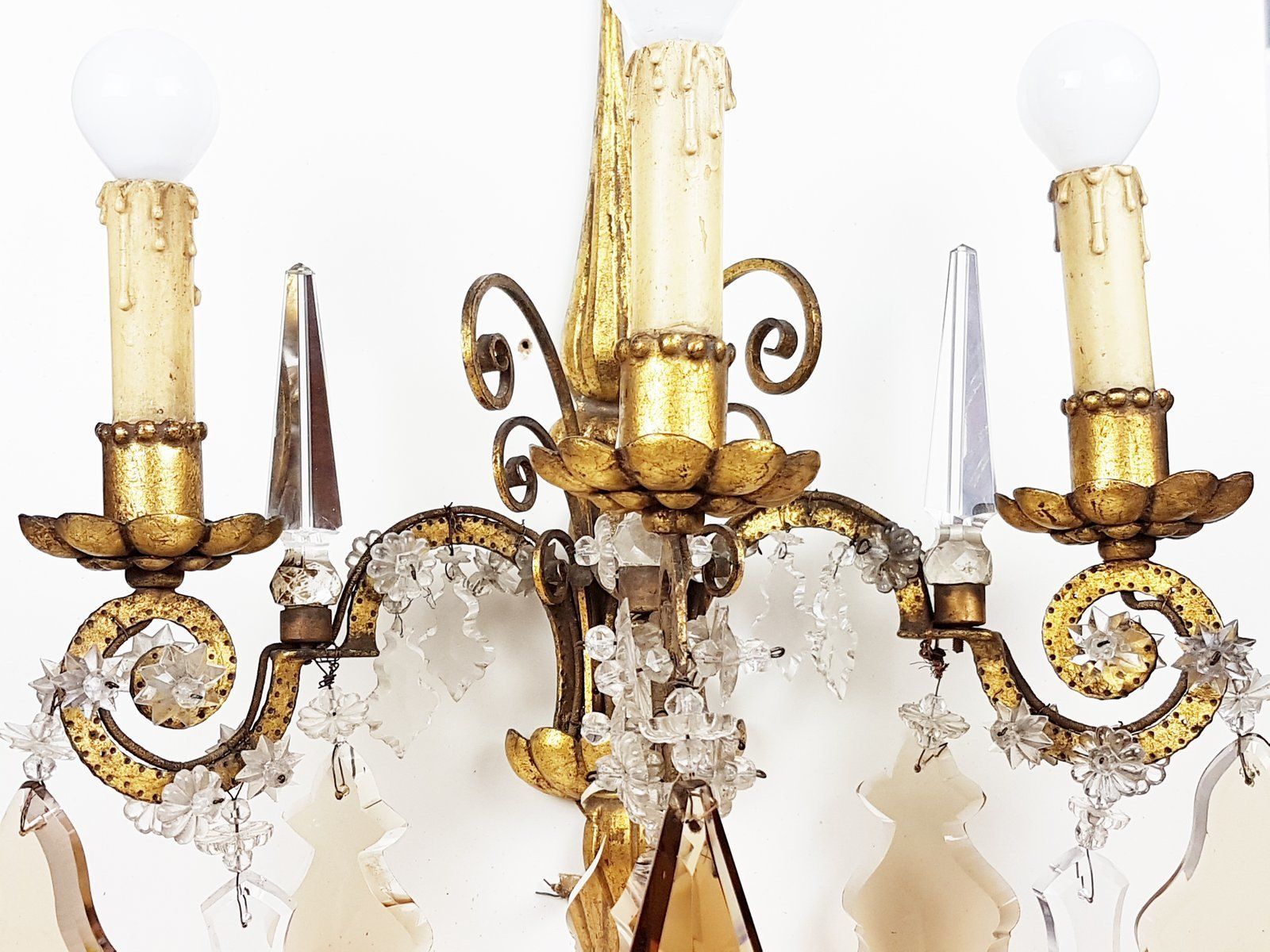 photo for sale Italian Gold Leaf Metal And Faceted Crystal Sconces With Stars And Obelisks Decor