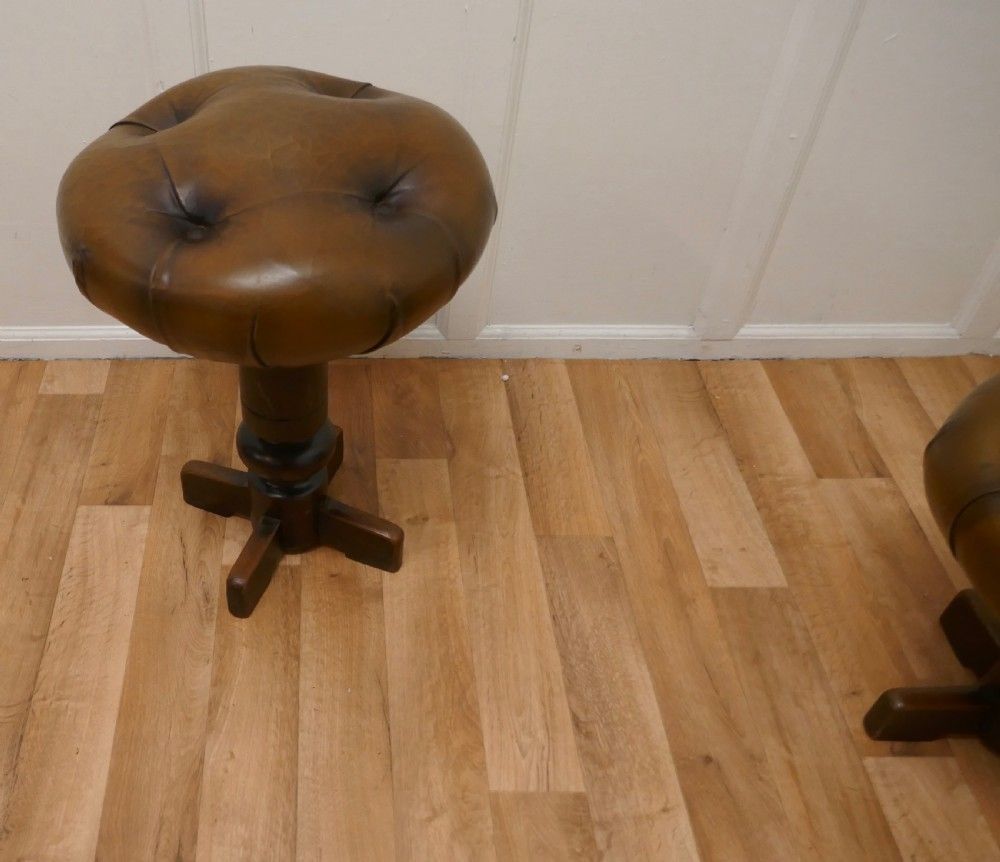 A Pair Of Sturdy French Button Leather Swivel Piano Stools photo for sale