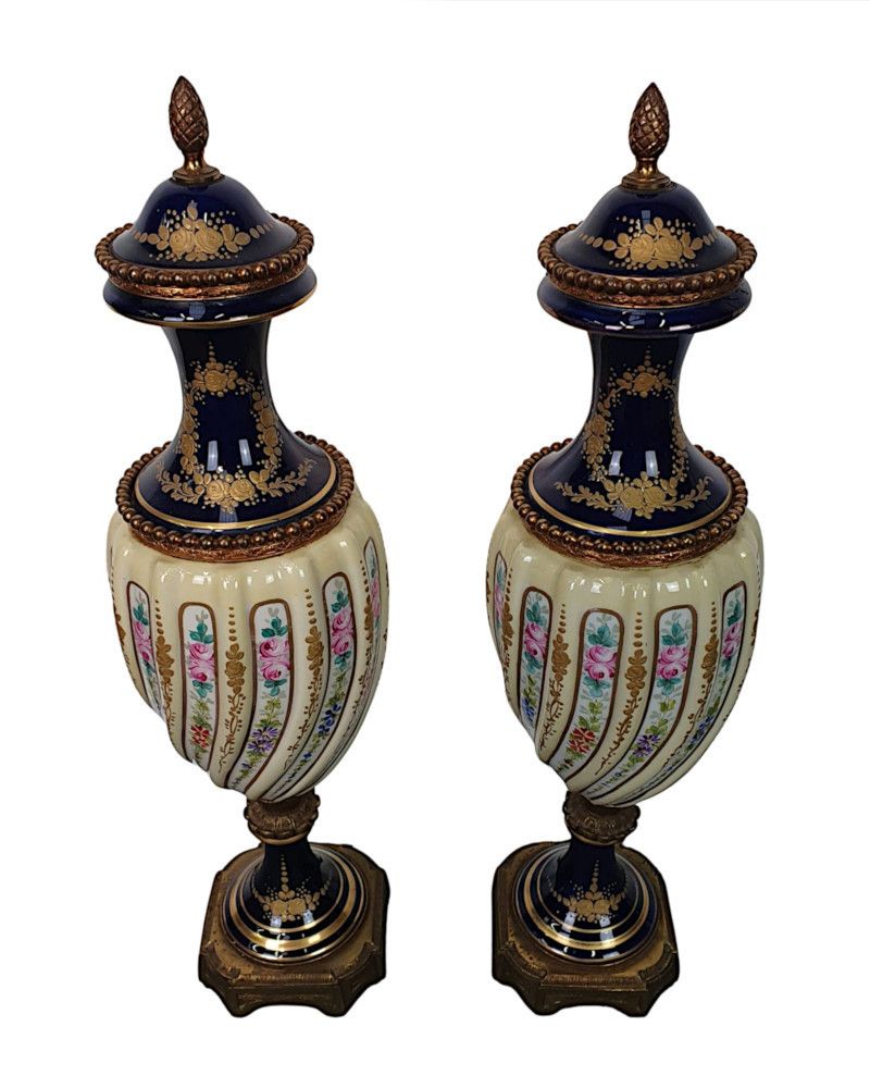 A Lovely Quality Pair Of 19th Century Urns In The Manner Of Sevres