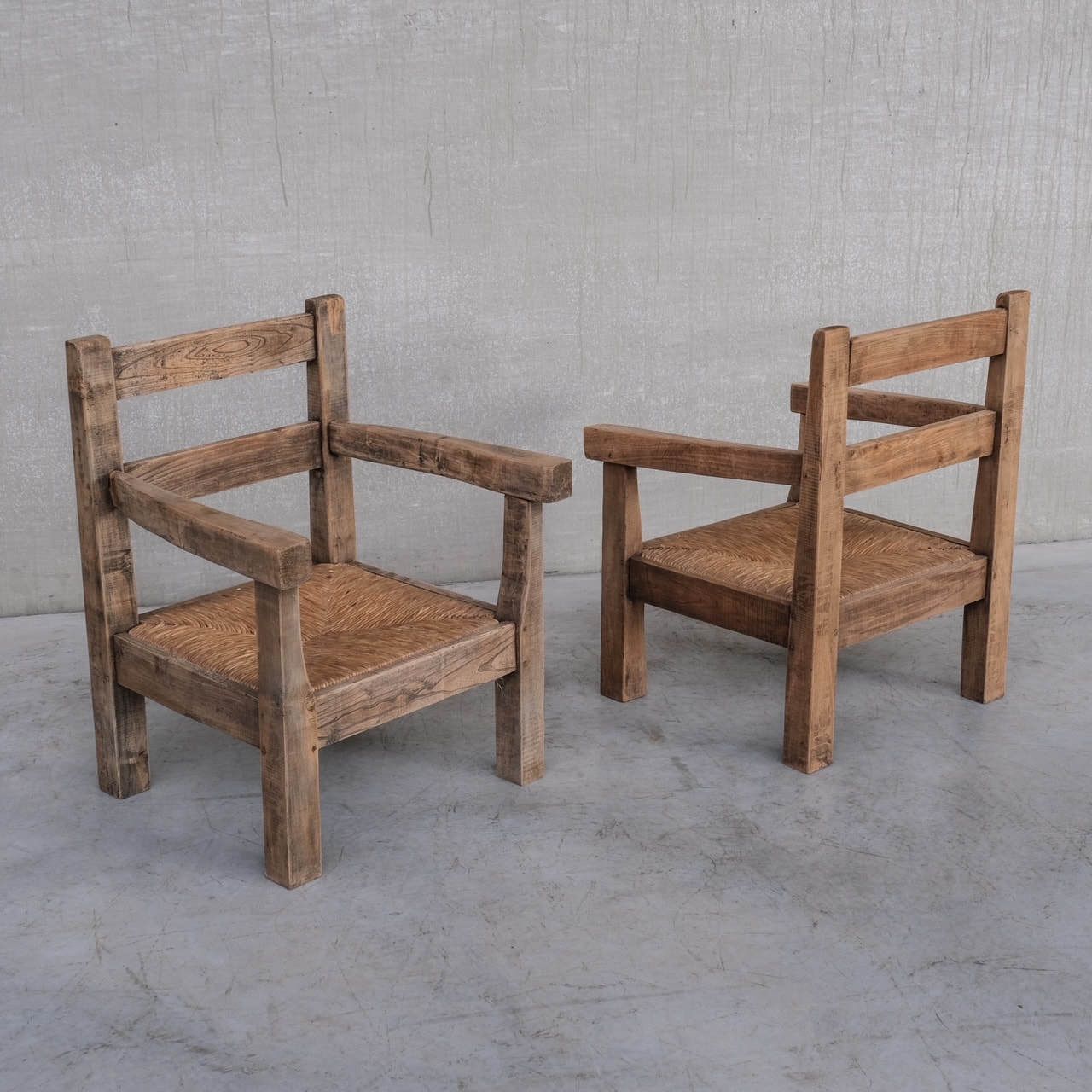Pair Of Mid Century French Rush Primitive Oak Armchairs