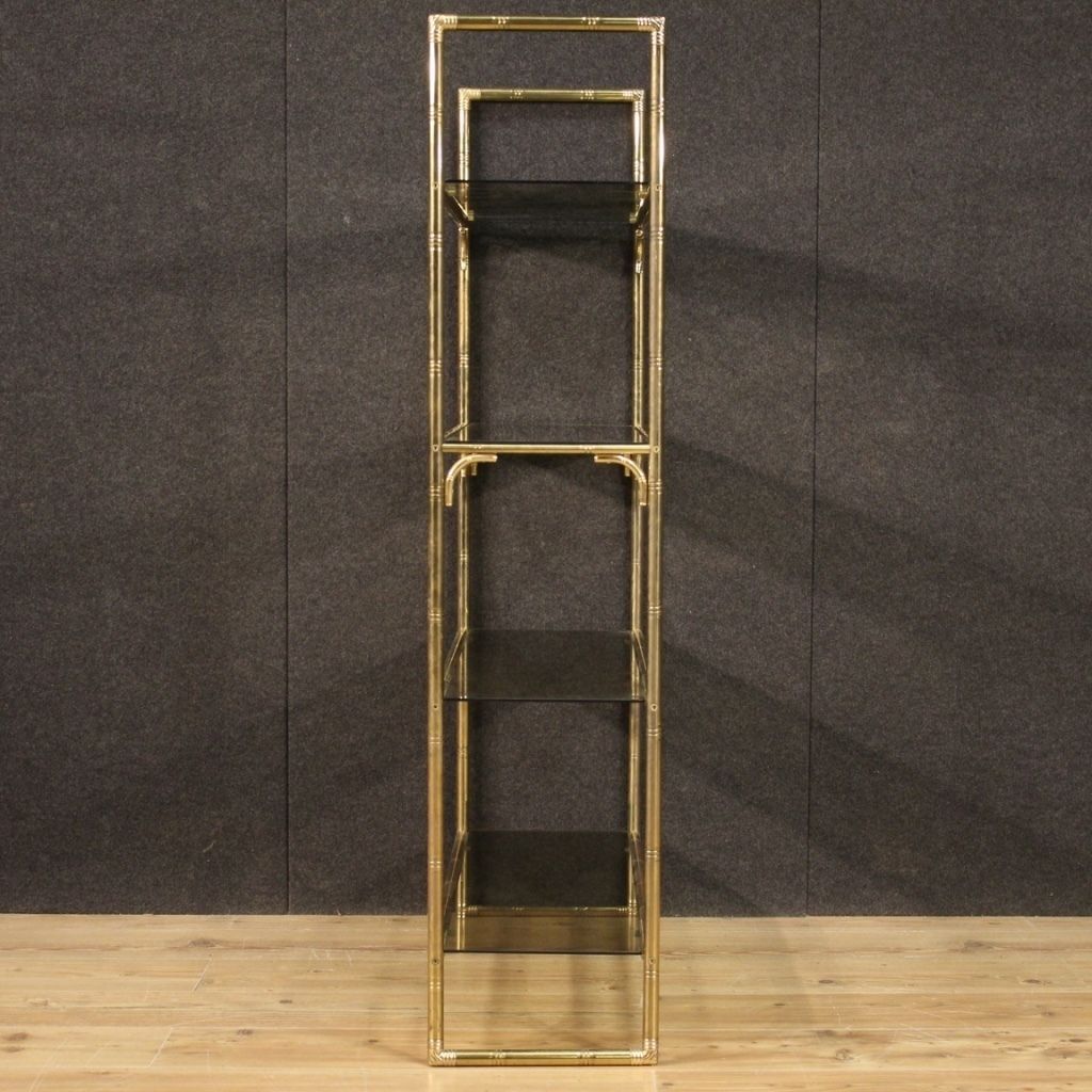 photo furniture Italian Bookshelf In Golden Metal With Glass Shelves
