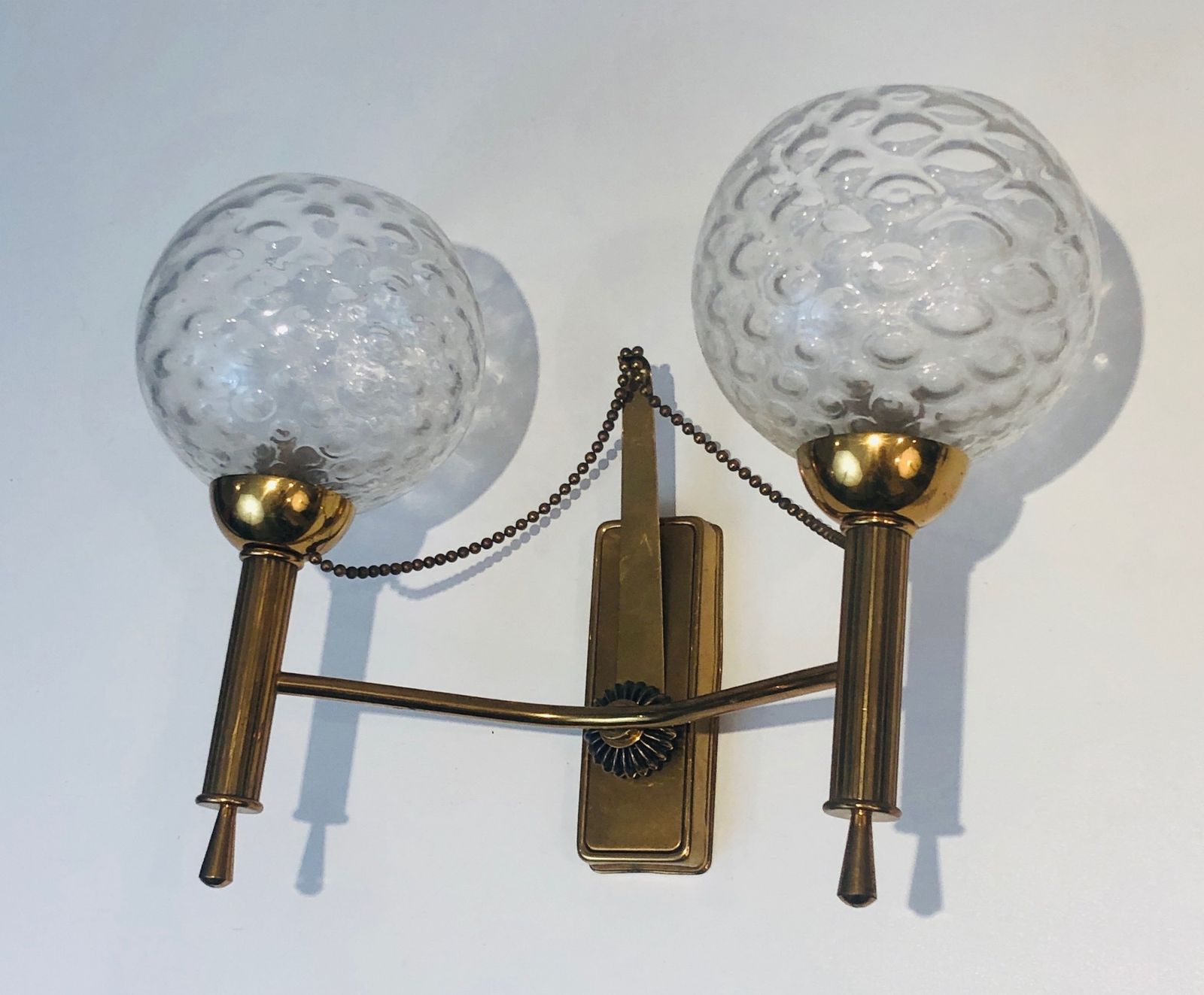 Lighting Pair Of Brass And Glass Ball Sconces. Around 1970 photo