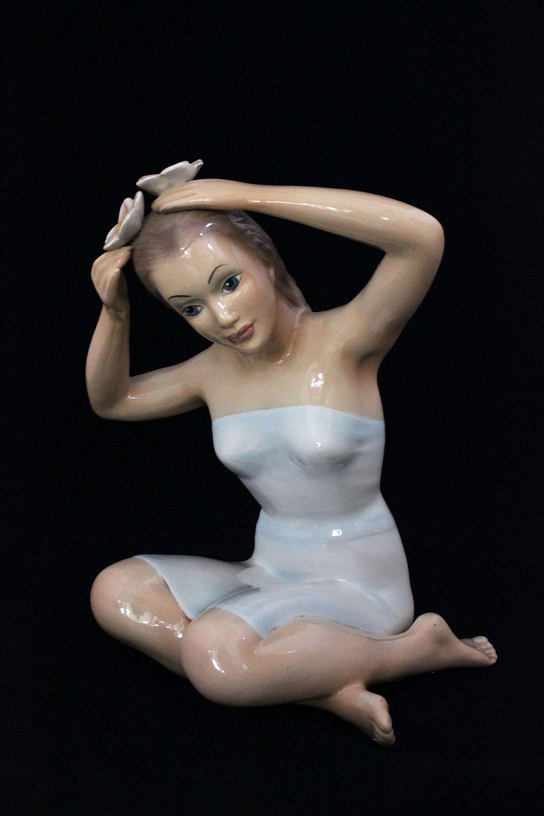Statuette Girl Sitting With Her Hands On Her Head By Ronzan, 1940s photo furniture