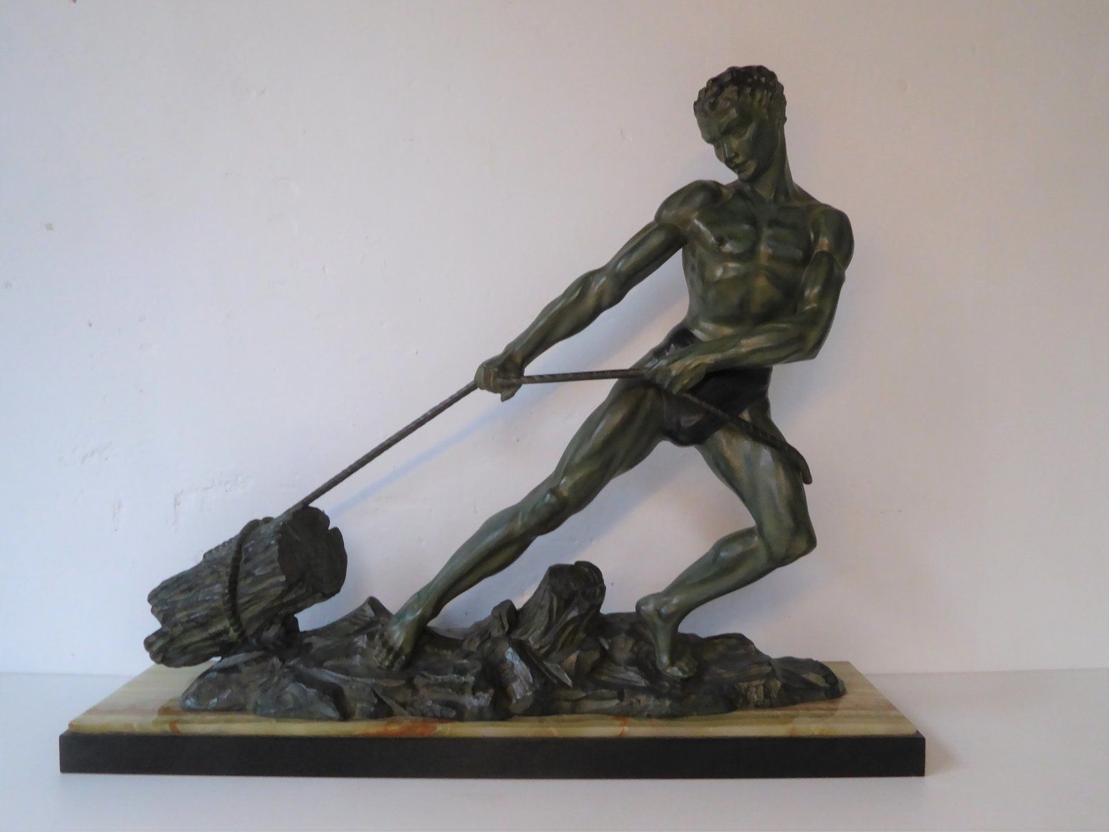 Art Deco Green Patinated Metal And Marble Sculpture Of Man Pulling Stone From Ucra, France