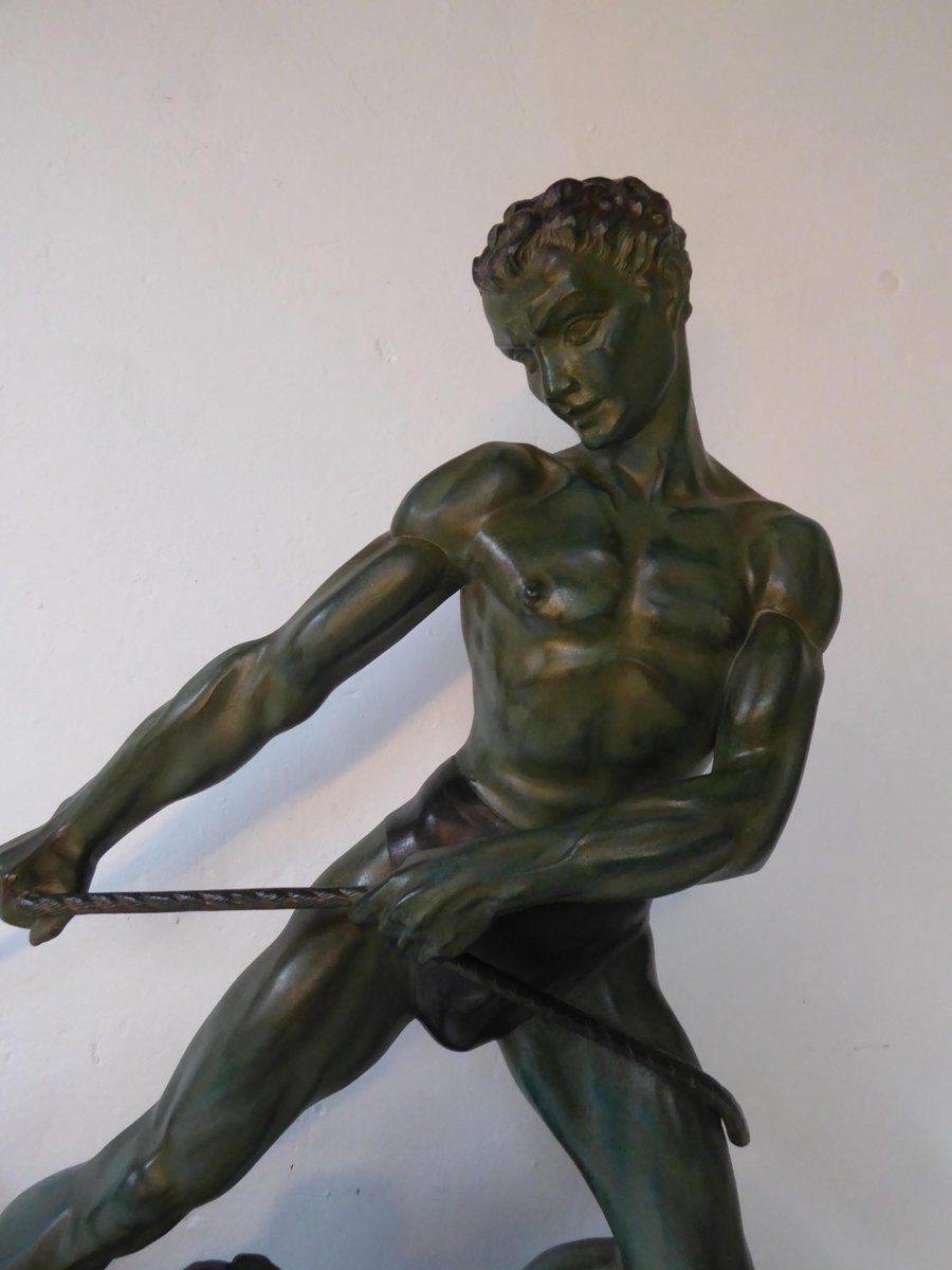 photo for sale Art Deco Green Patinated Metal And Marble Sculpture Of Man Pulling Stone From Ucra, France