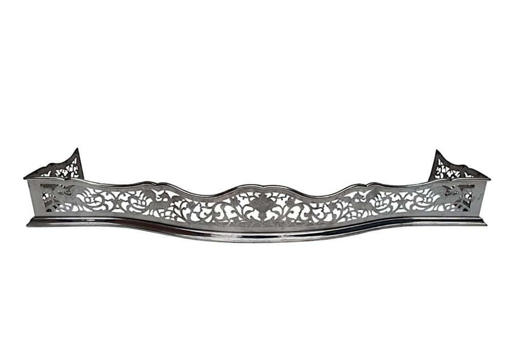 A Rare 19th Century Polished Steel Fender With Flower And Dragon Detail