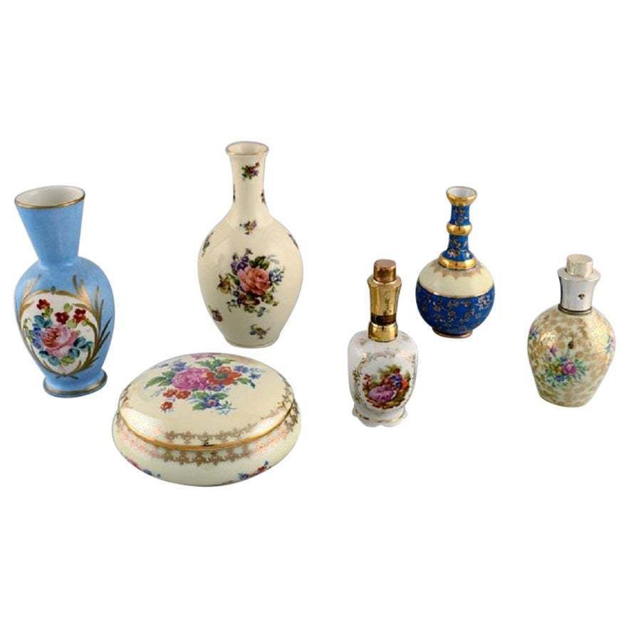 Limoges, France. Two Perfume Bottles, Three Vases And Lidded Box In Porcelain