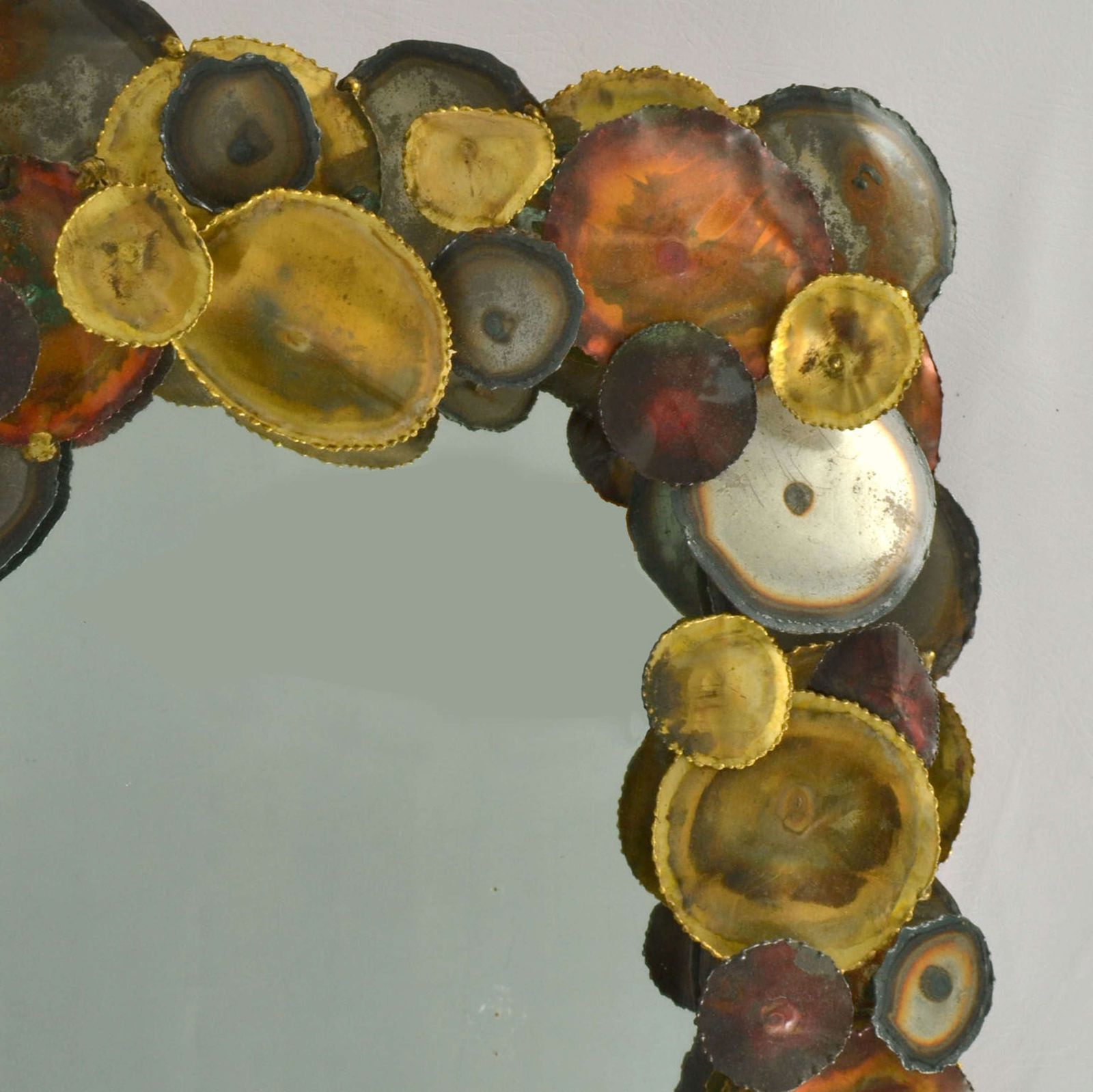 Brutalist Wall Mirror Edged With Metal Circles In The Style Of Curtis photo furniture