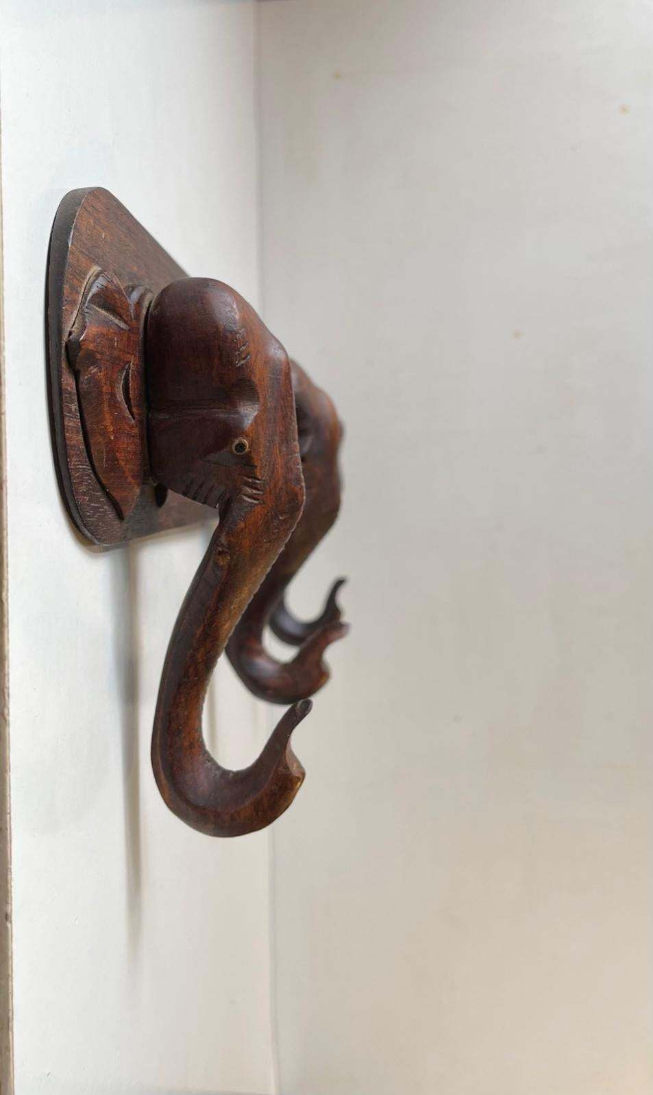 photo furniture Hand Carved Elephant Coat Or Towel Rack In Dark Wood, 1930s