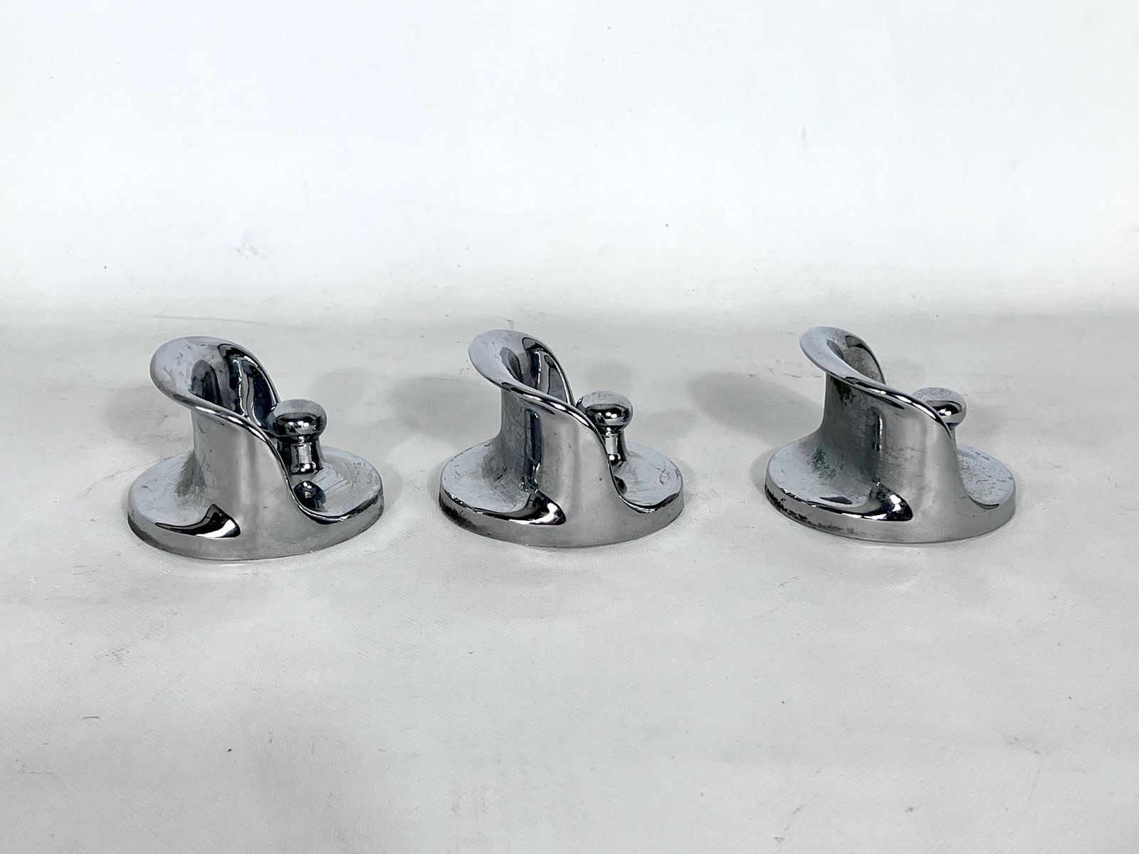 photo furniture Mid Century Modern Set Of Three Chrome Plastic Coat Hangers Olaf Bohr 1960s