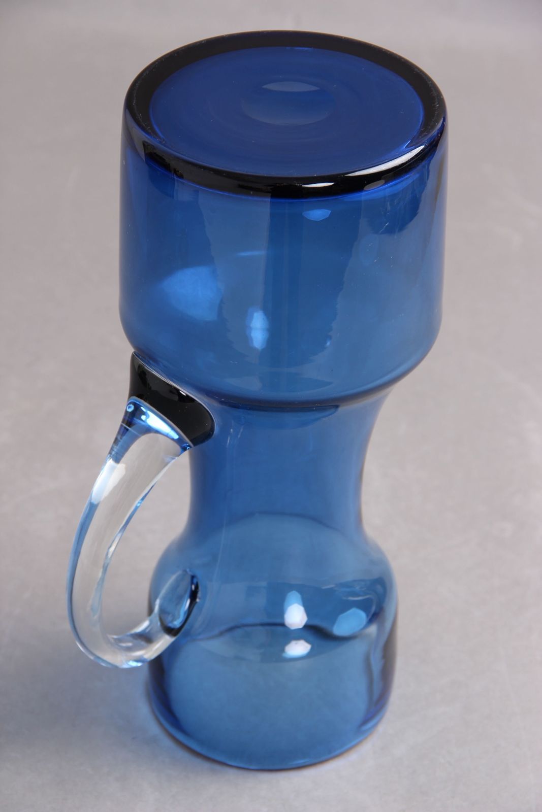 Glass Jug In Blue Glass With Attached Handle In Transparent Glass, Typical 1950s 1960s Design In High Quality. photo furniture