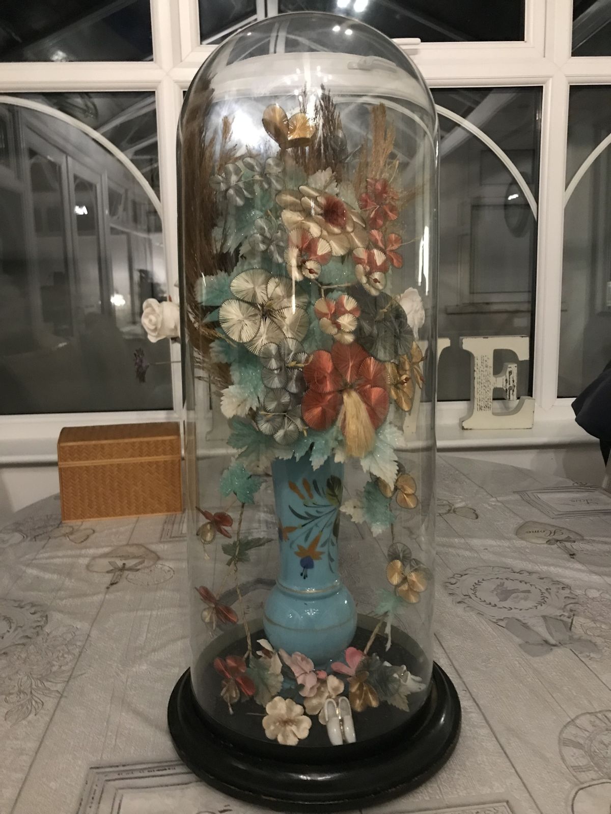Tall Victorian Glass Dome Containing A Vase Of Silk Flowers . photo furniture
