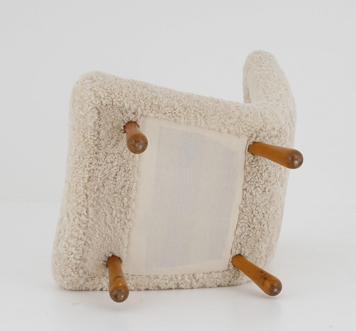 photo furniture Scandinavian Mid Century Lounge Chair In Sheepskin