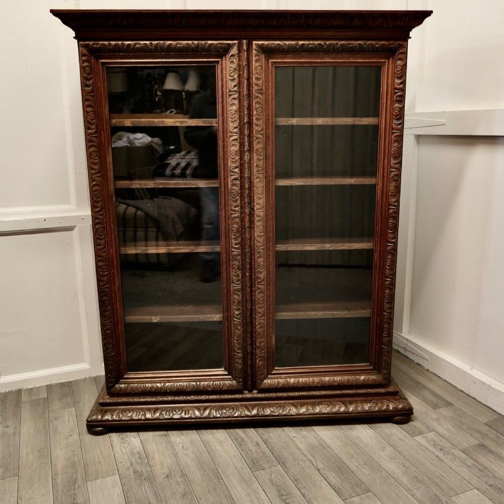 Fine Quality 19th Century Carved Oak Glazed Bookcase.