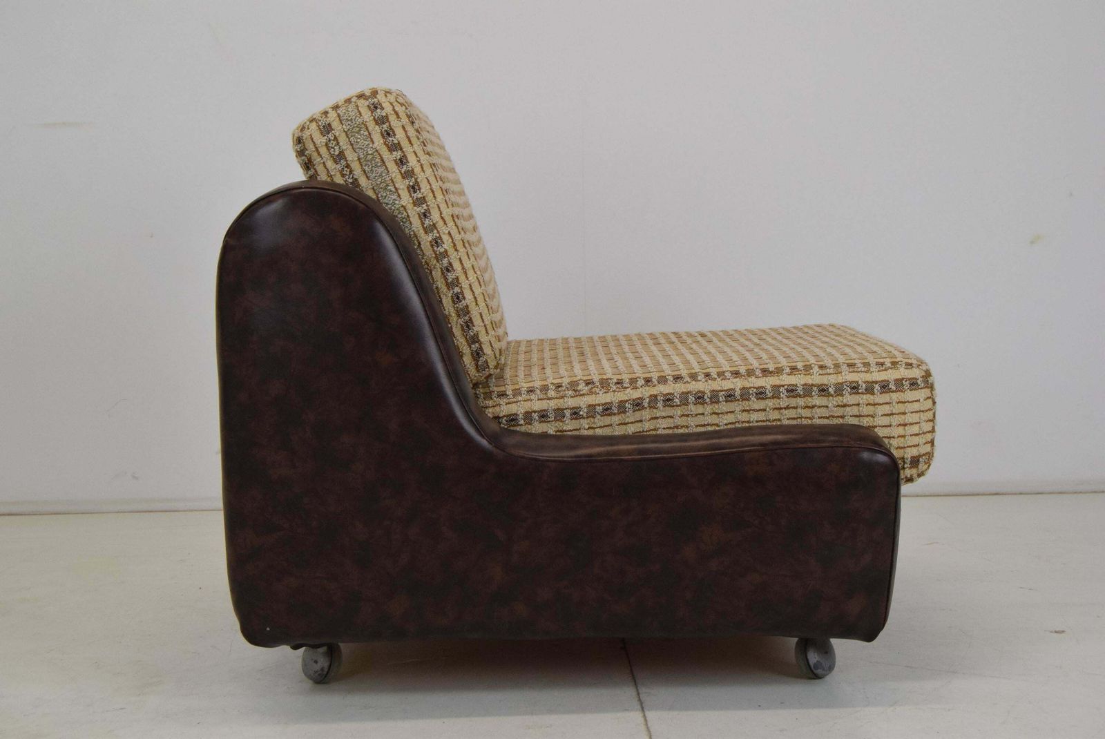 Mid Century Leatherette Armchair On The Wheels,1970's. photo vintage