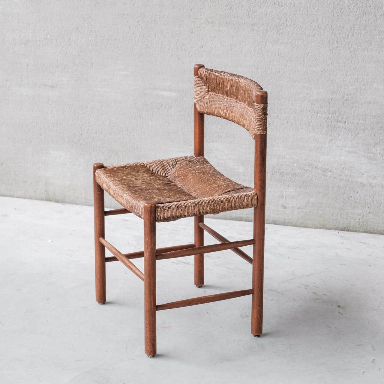 photo furniture Set Of Four Mid Century Charlotte Perriand 'Dordogne' Rush Dining Chairs