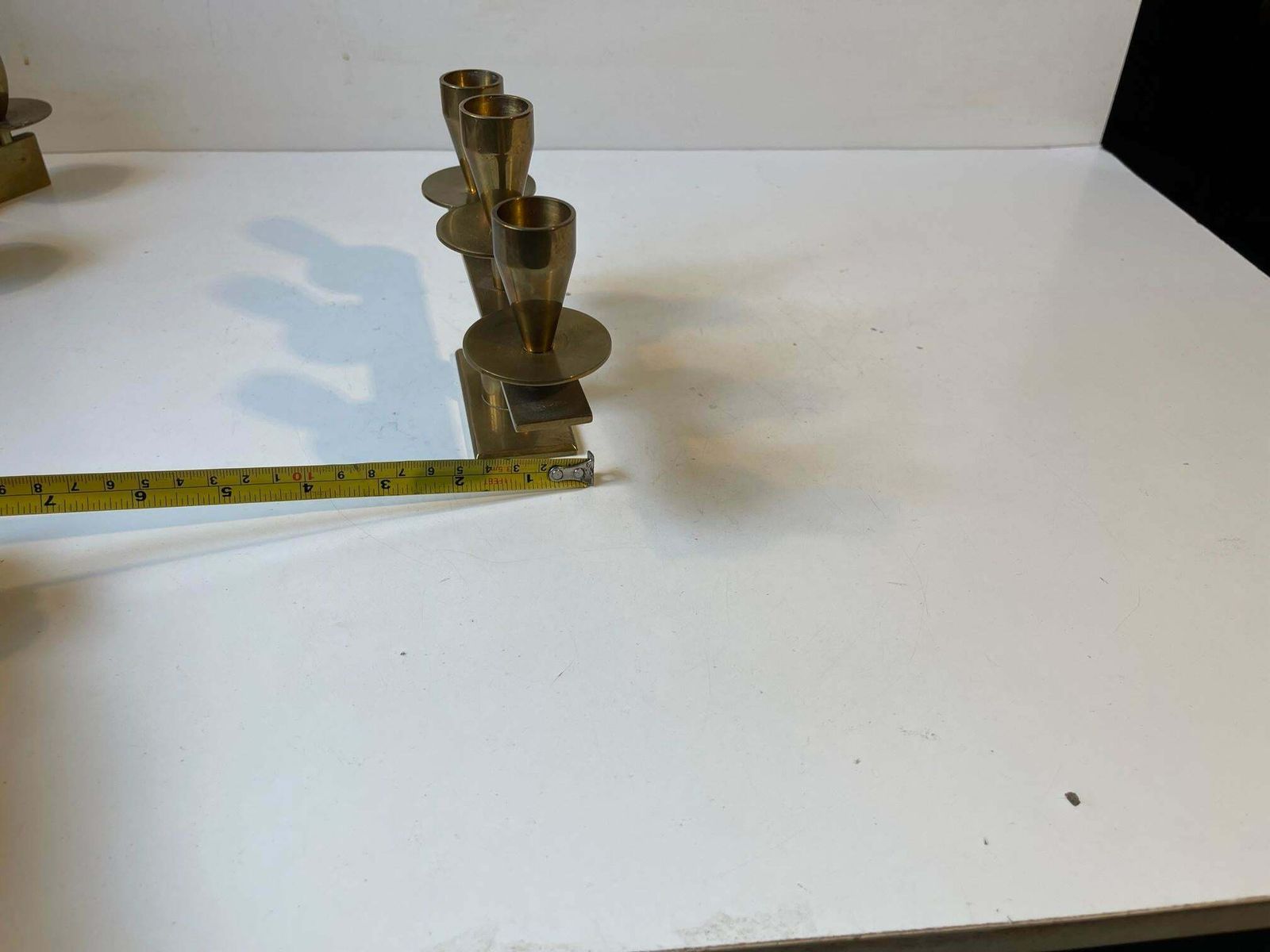 photo buy Mid Century Candleholders In Bronze By Kara Copenhagen