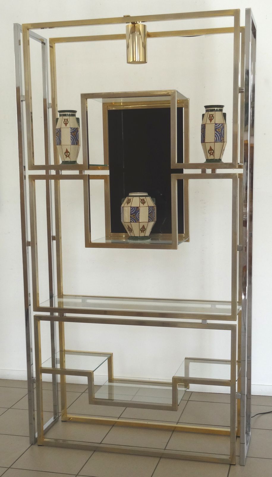 An Illuminating Book Case In Gold And Chromium Plated Aluminium With Black Tinted Glass. photo furniture