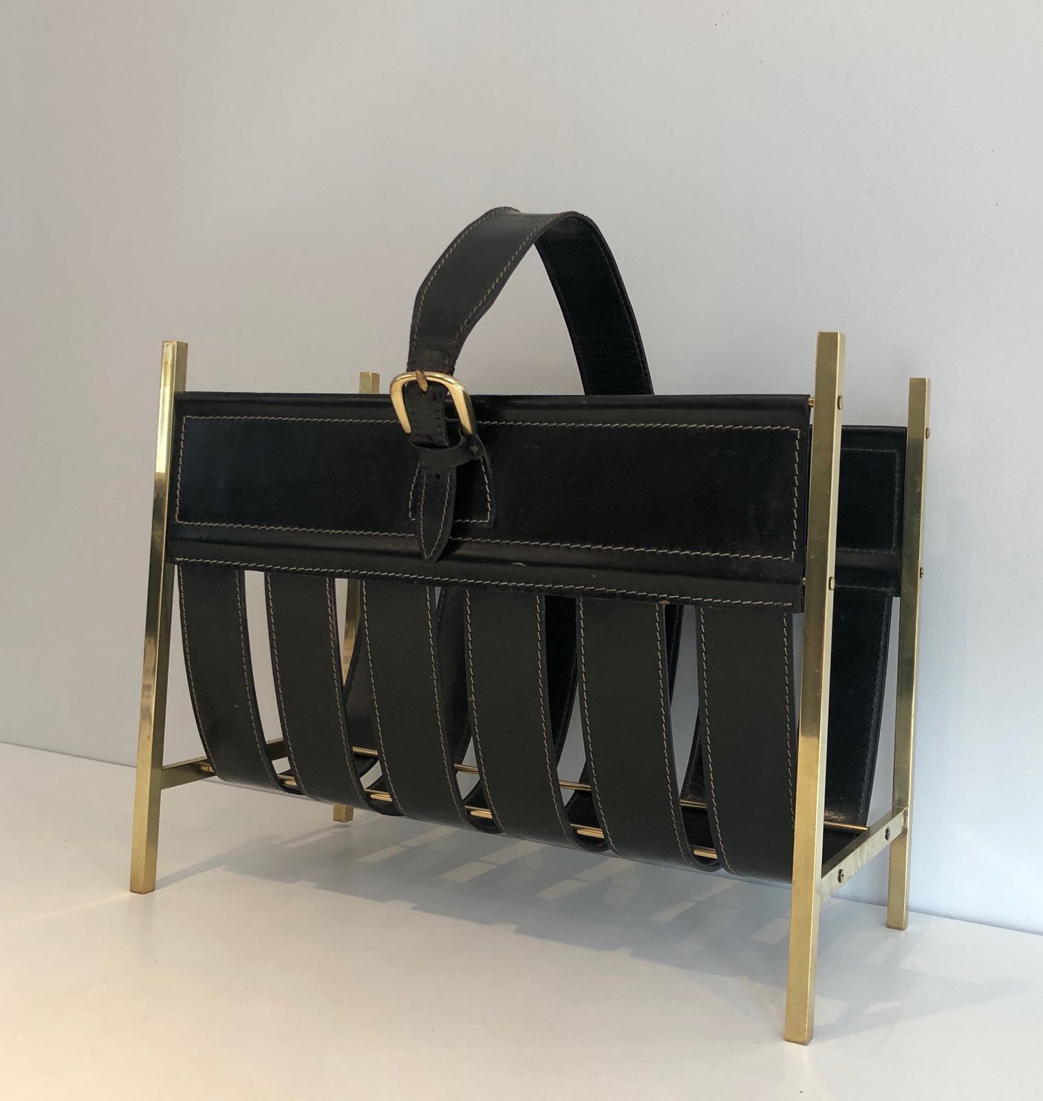 Brass And Leather Magazine Rack Representing A Handbag. Work Of Jacques Adnet. Around 1940 photo furniture