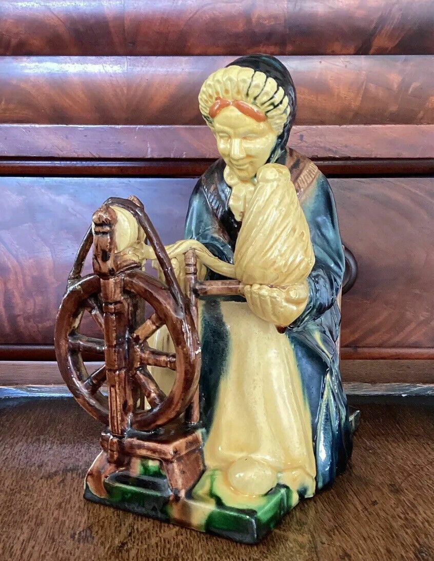 Early 20th C Continental Bisque Pottery Figurine. Dutch Woman Spinning Yarn