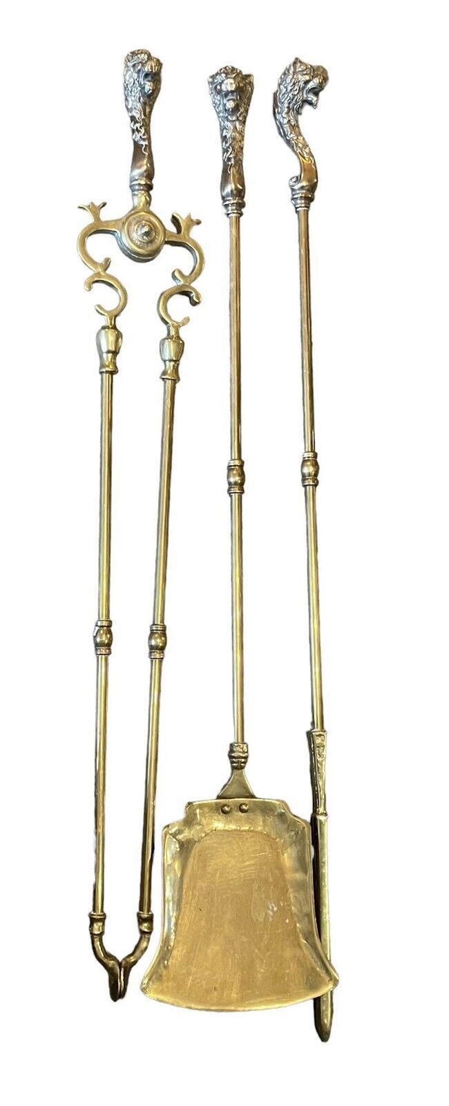 A Set Of Brass Lion Head Fire Irons photo furniture