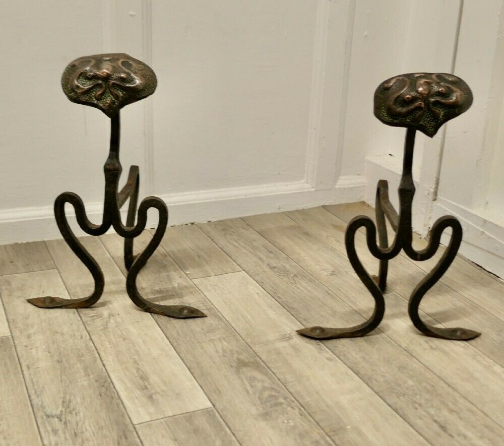 A Pair Of Arts And Crafts Copper And Iron Andirons Or Fire Dogs